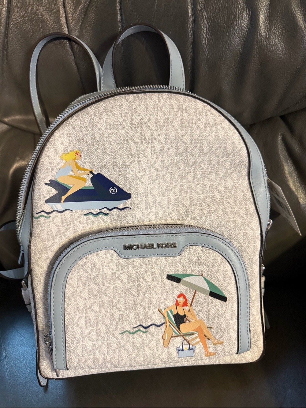 Michael Kors Cream Logo Backpack with Light Blue Trim and Beach Motifs